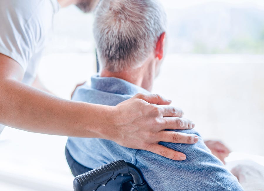 Health professional caring for a patient