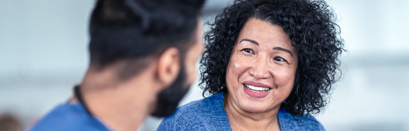 Nurse having a conversation with a patient