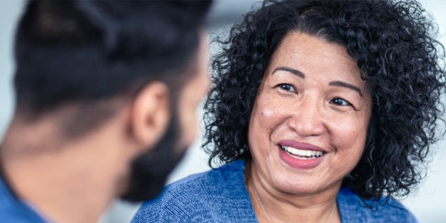 Nurse having a conversation with a patient